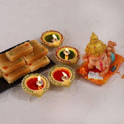Bal Ganesha Idol And Milk Cake With Diyas