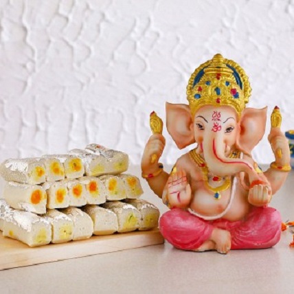 Raja Ganesha Idol And Kaju Rolls
